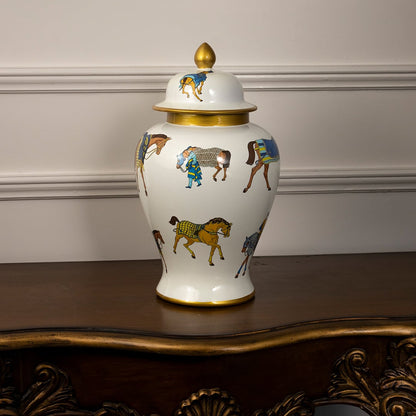 Elegant white ceramic jar with golden lid and multicolor horse print perfect for luxury home or tabletop decoration.