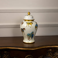 White ceramic jar with golden lid and colorful horse artwork perfect for elegant traditional home decoration styling.
