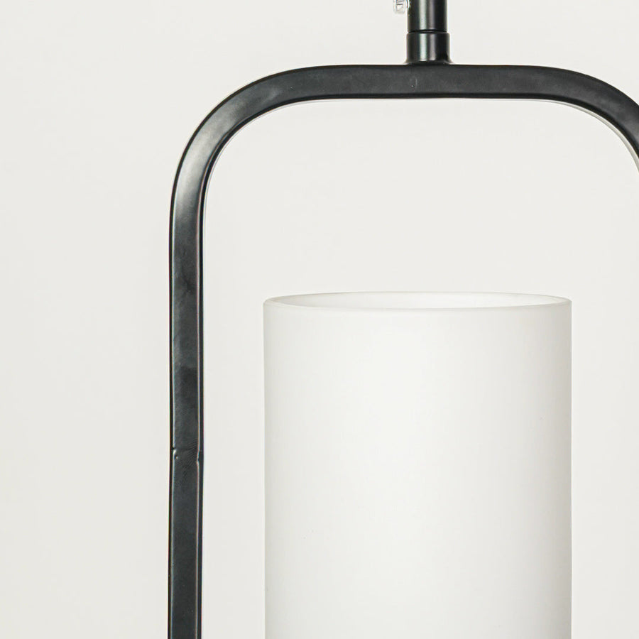 Closeup of black metal and white glass pendant light highlighting refined details and craftsmanship.
