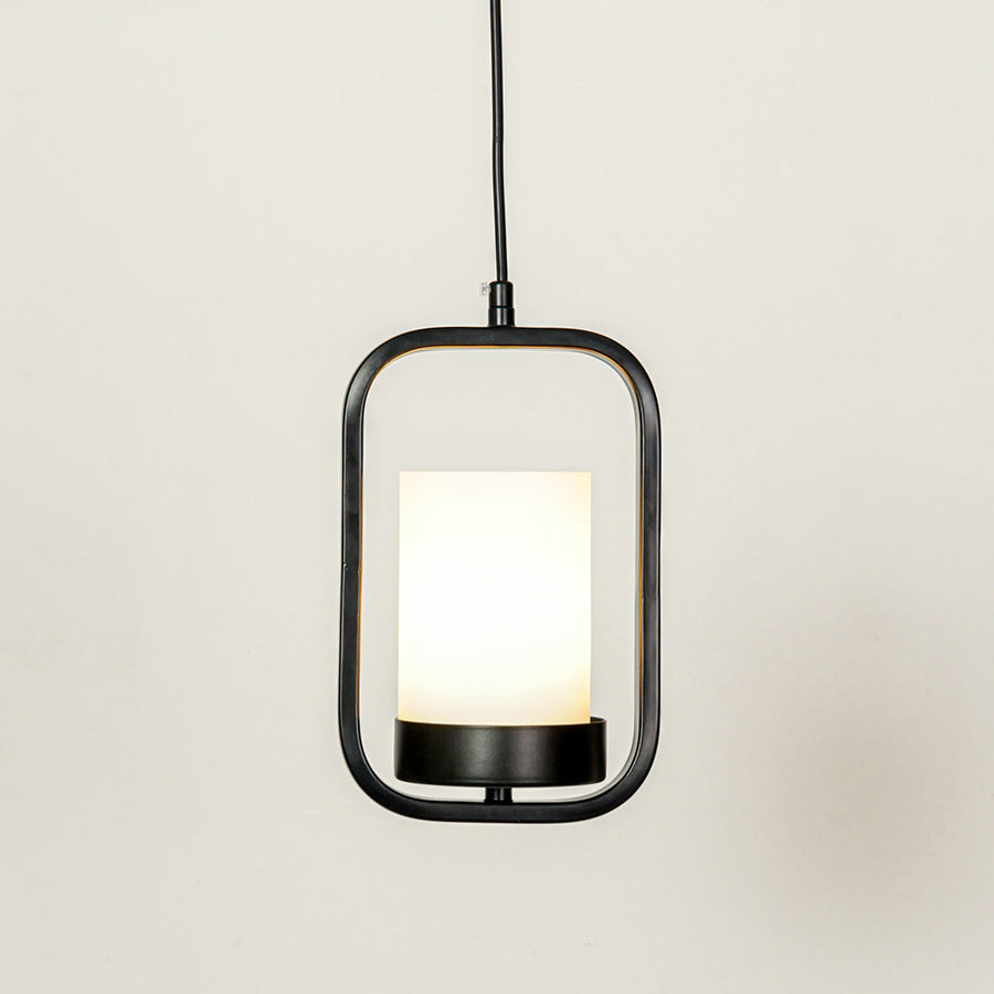 Black metal and white glass pendant light with modern lantern design for elegant home decor spaces.