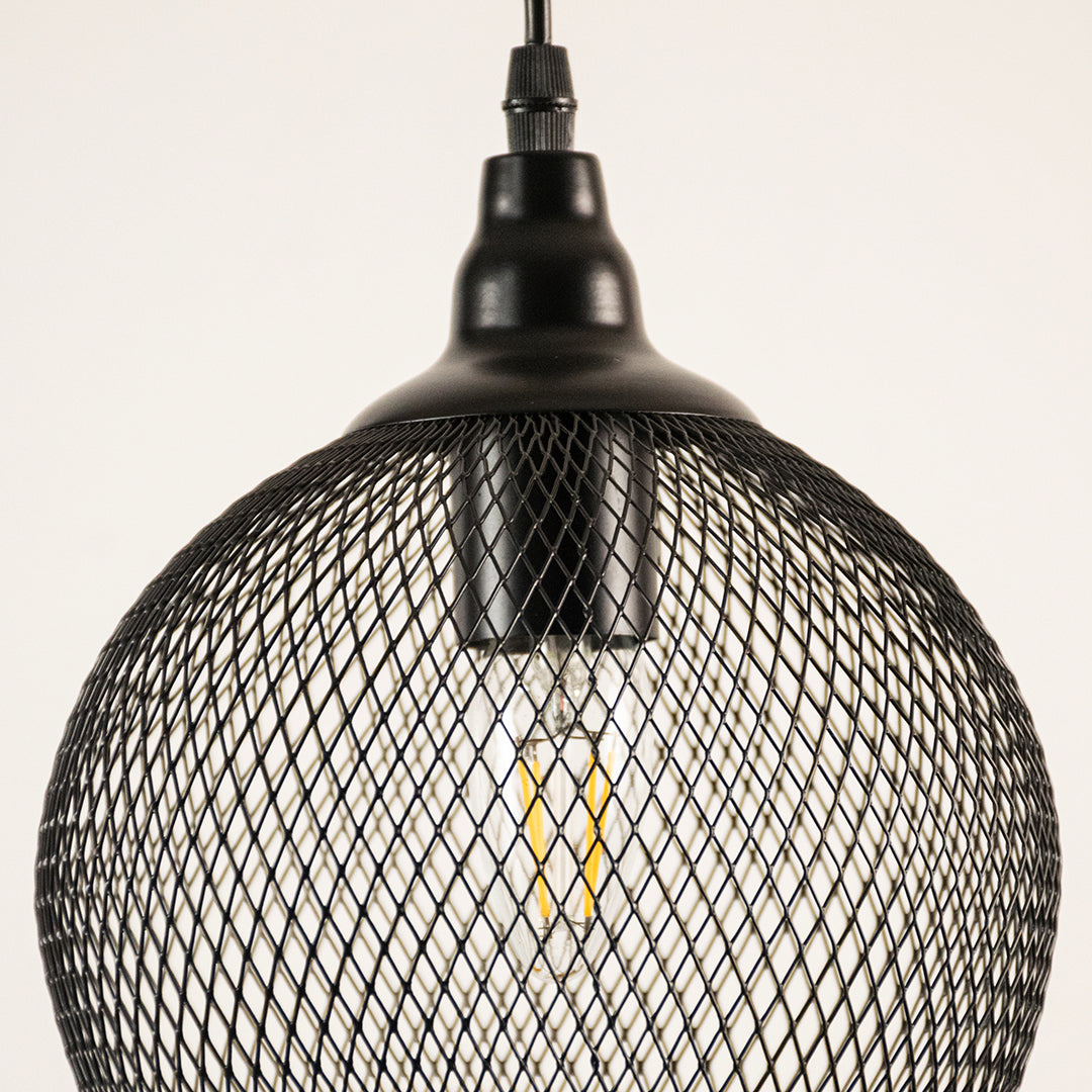 Black mesh pendant light with a white background