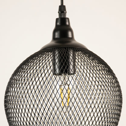 Black mesh pendant light with a white background