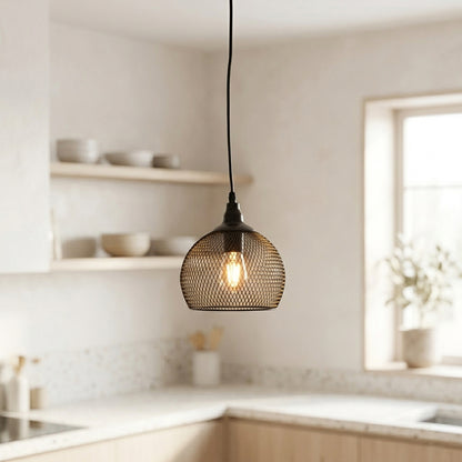 Modern pendant light hanging in a kitchen with neutral tones