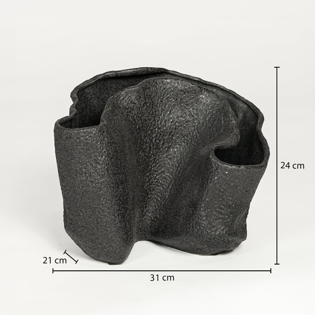 Black textured metal decorative vase measuring 24 cm height 31 cm width and 21 cm depth ideal for modern interior decor styling.