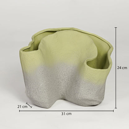 Green ceramic sculpted planter measuring 24 cm height 31 cm width and 21 cm depth perfect for statement decor placement.