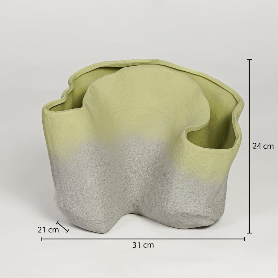 Green ceramic sculpted planter measuring 24 cm height 31 cm width and 21 cm depth perfect for statement decor placement.