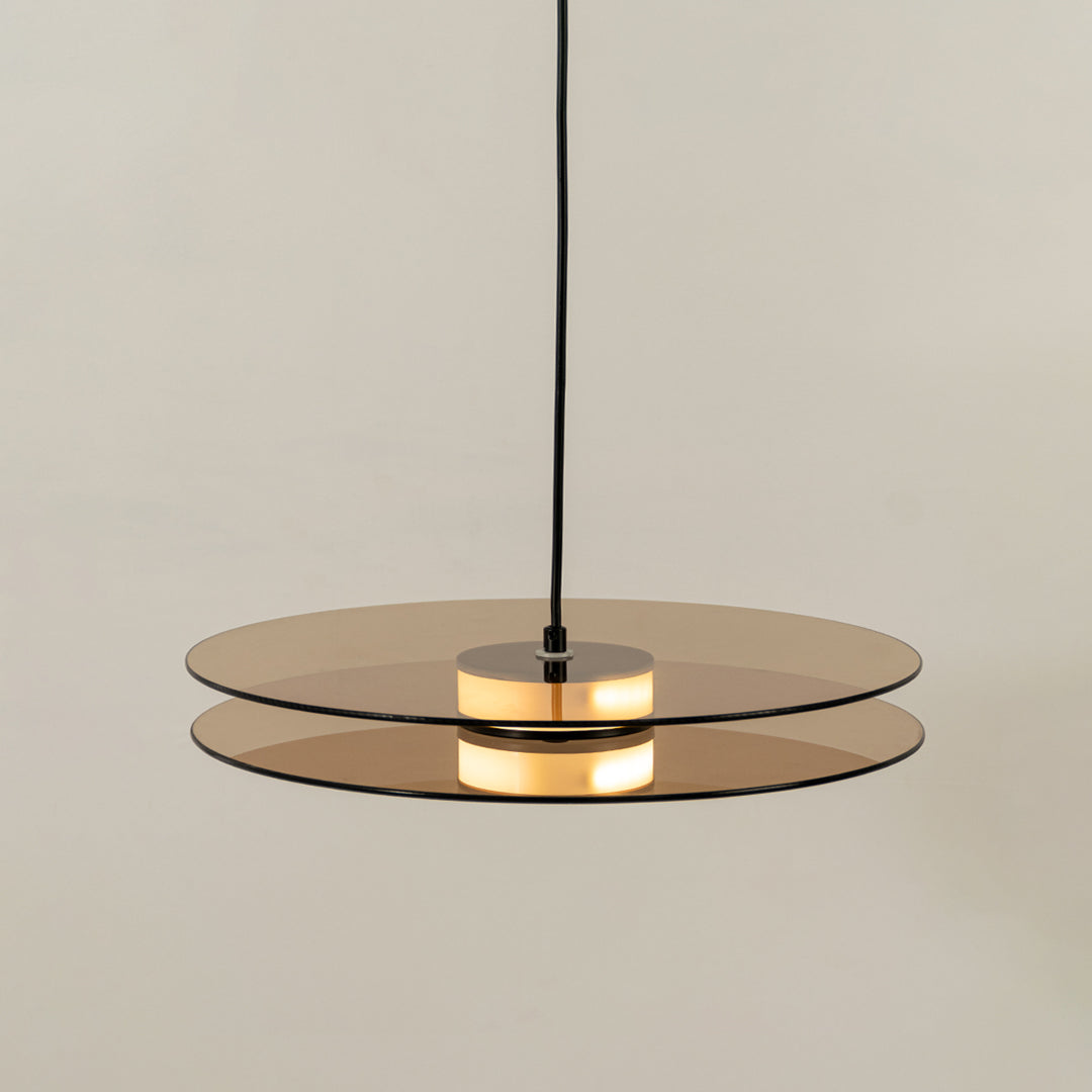 Brown wood and brass metal disc pendant light designed for stylish contemporary home decor spaces.