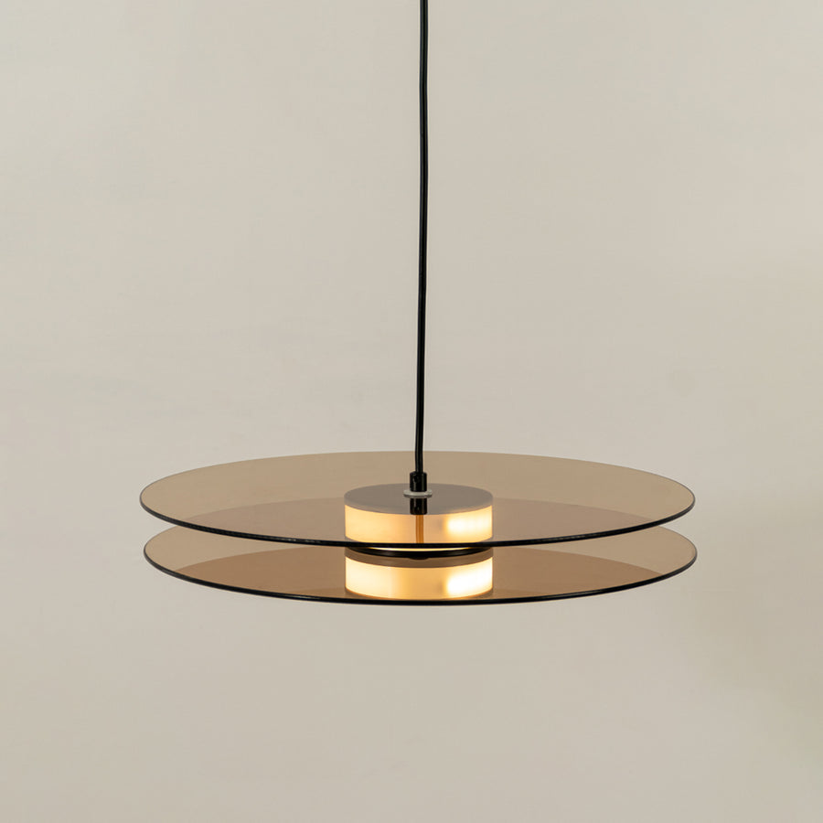 Brown wood and brass metal disc pendant light designed for stylish contemporary home decor spaces.