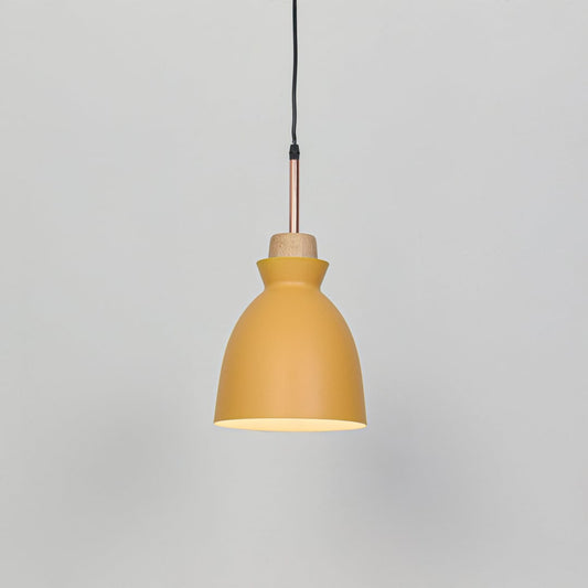 Yellow metal pendant ceiling light switched on against white background producing warm focused downward illumination.