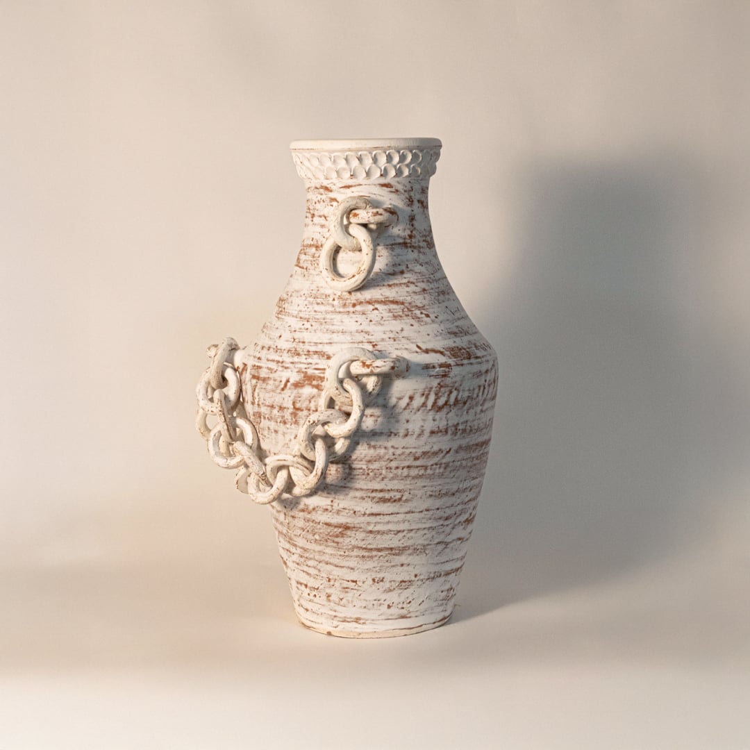 Rustic tall chain vase displayed on white background highlighting handcrafted ceramic texture and sculptural chain detail.