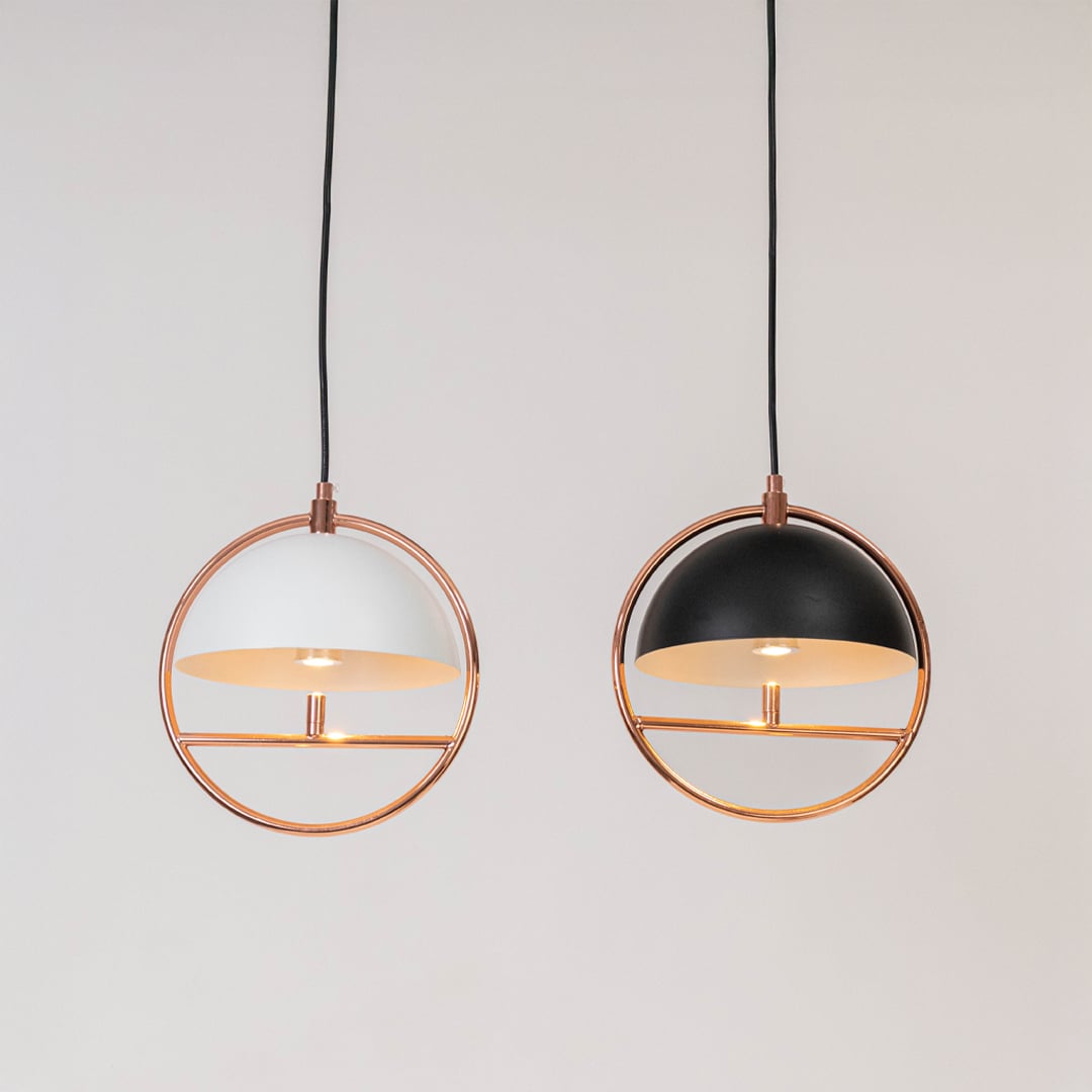 Set of pendant ceiling lamps in black and white dome shades with golden frame design for modern home interior lighting.