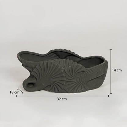 Black ceramic decorative shell bowl showing 32 cm length 18 cm width and 14 cm height ideal for dining table centerpiece decor.