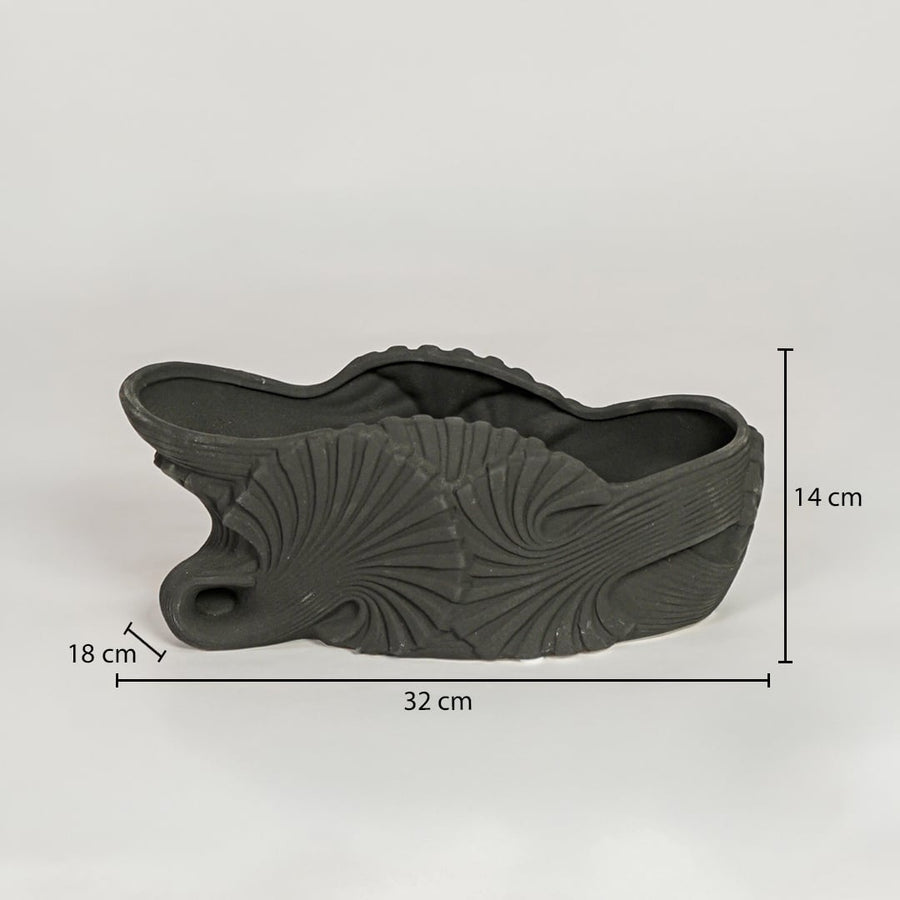 Black ceramic decorative shell bowl showing 32 cm length 18 cm width and 14 cm height ideal for dining table centerpiece decor.
