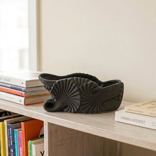 Black ceramic decorative shell bowl with sculpted texture perfect for dining table centerpiece console styling and modern living room decor.
