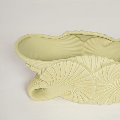 Light green ceramic decorative shell bowl showing detailed sculpted texture perfect for artistic centerpiece styling on dining table or console.