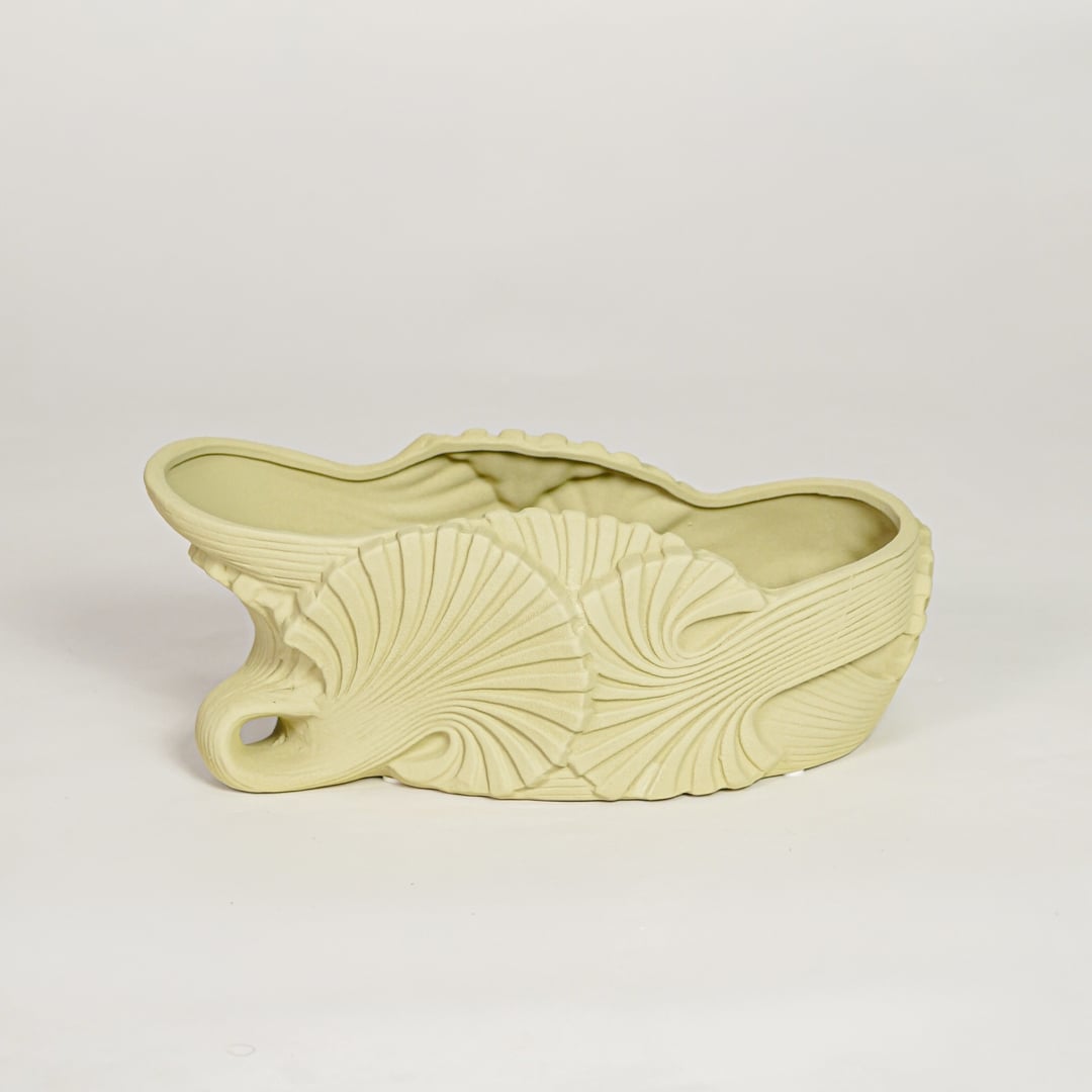 Modern light green ceramic shell shaped decorative bowl for fruit display dining table centerpiece and stylish living room decor.