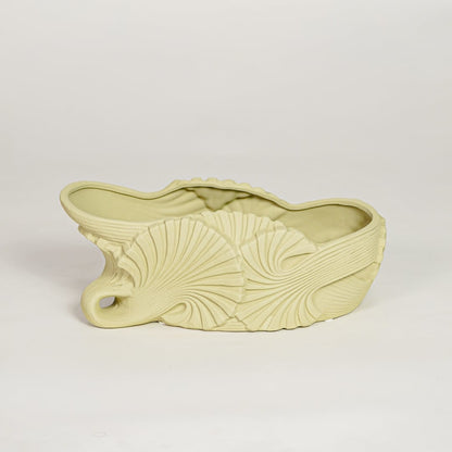 Modern light green ceramic shell shaped decorative bowl for fruit display dining table centerpiece and stylish living room decor.