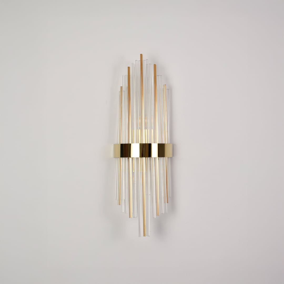 Elegant gold metal and crystal wall light switched off on white background ideal for modern decorative wall lighting.