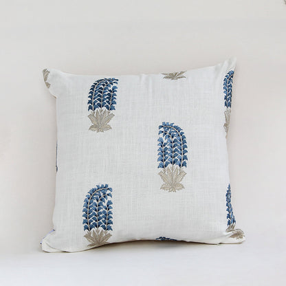White cushion cover with blue handblock style floral print crafted in fabric ideal for sofa chair and bed decor styling.