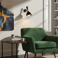 Contemporary black metal spotlight wall light enhancing stylish living room reading corner ambiance.