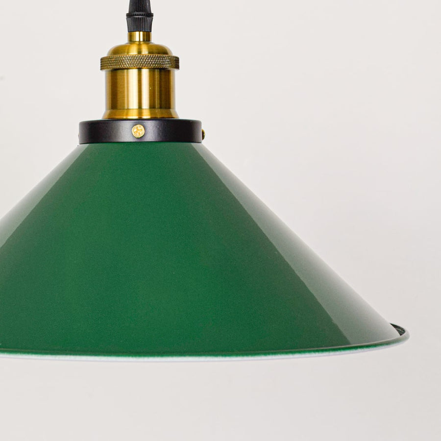 Closeup view of green metal hangingl lamp with gold finish detailing showing smooth shade texture and premium craftsmanship for indoor wall decor.