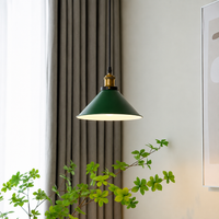 Lifestyle image of industrial green enamel pendant light for elegant dining room decor styling and modern home room lighting.