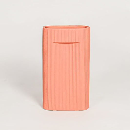 Contemporary coral ceramic flower vase with minimalist sculpted design perfect for entryway table living room decor display.
