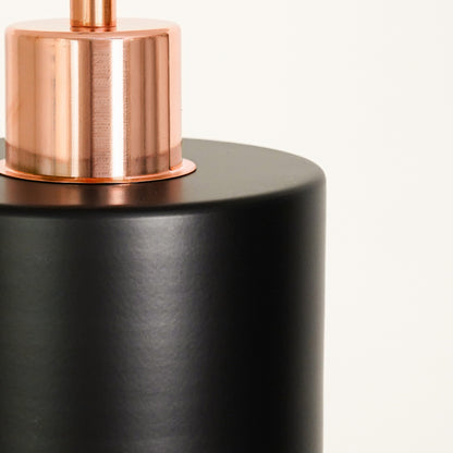 Closeup image of industrial black rose gold pendant light for elegant dining room decor styling with durable fine finish.
