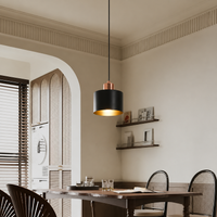 Lifestyle image of industrial black rose gold pendant light for elegant dining room decor styling with beautiful finish.