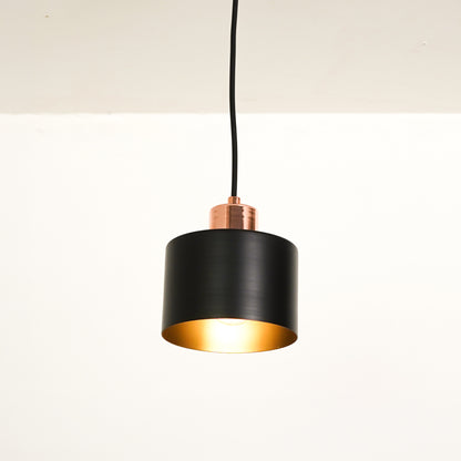 White background image of industrial black rose gold light for elegant dining room decor styling with bright illumination.