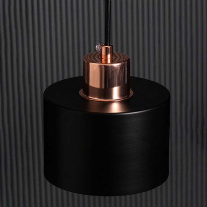 Closeup of amber globe wall light showing the smooth round glass shade and polished gold metal details for modern decorative home lighting.