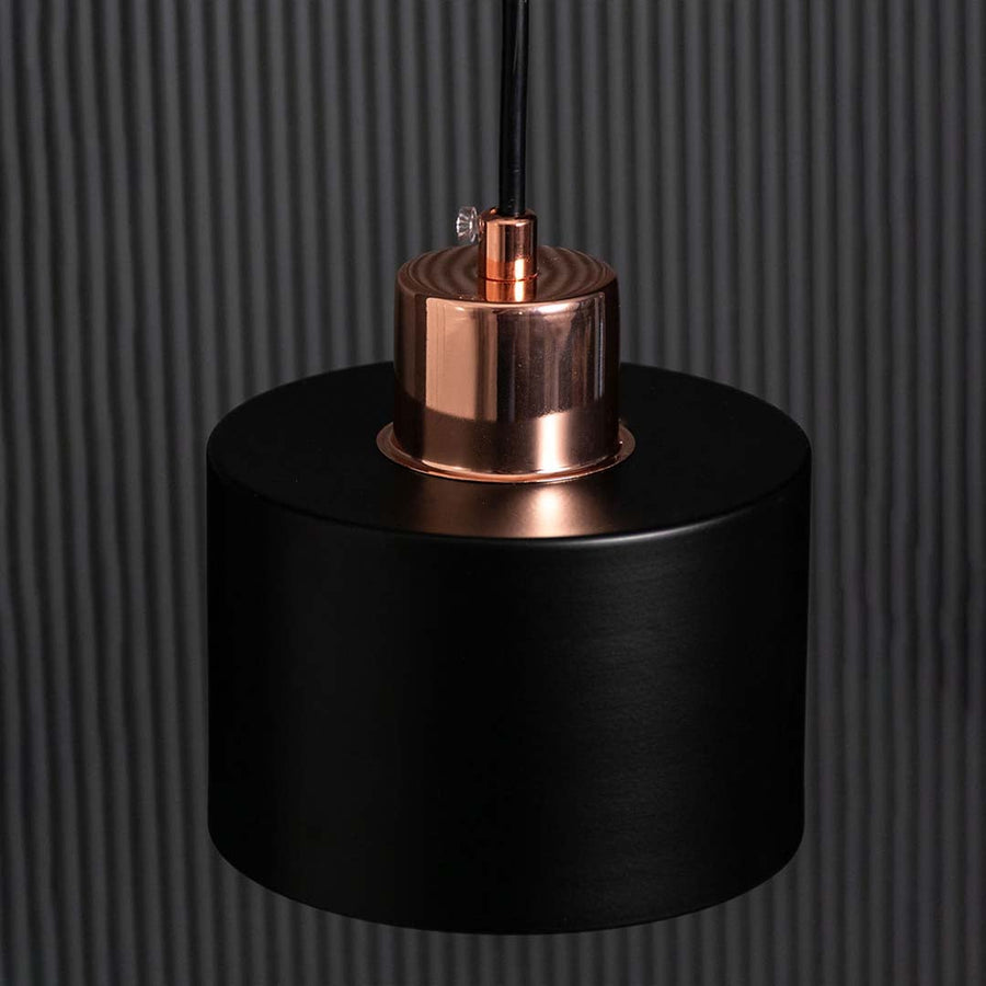 Closeup of amber globe wall light showing the smooth round glass shade and polished gold metal details for modern decorative home lighting.