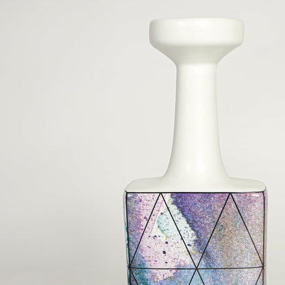 Closeup image of white ceramic bottle vase with purple abstract artwork for modern tabletop decor styling.