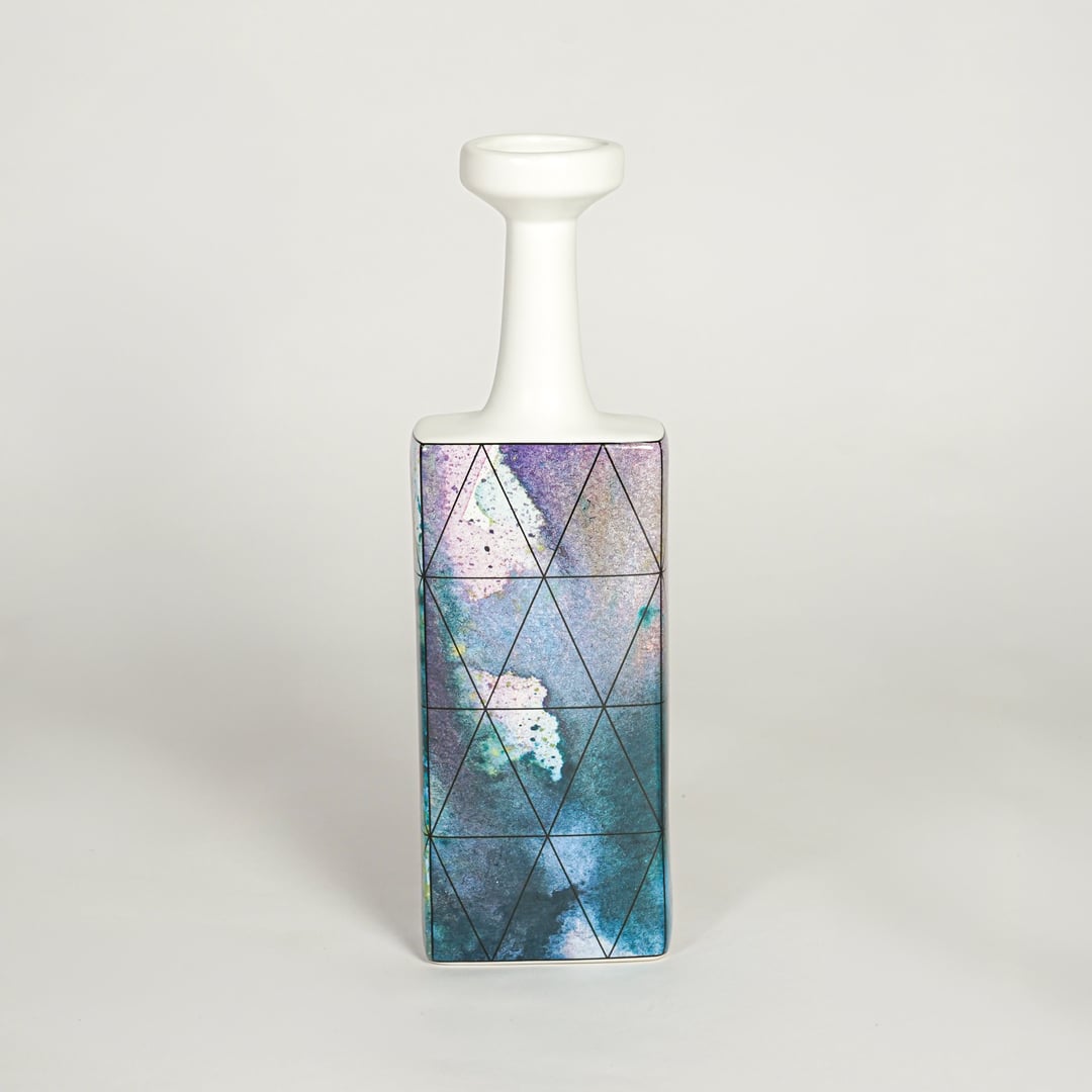 Purple glass bottle vase for elegant coffee table placement and modern living room decor styling accent piece.
