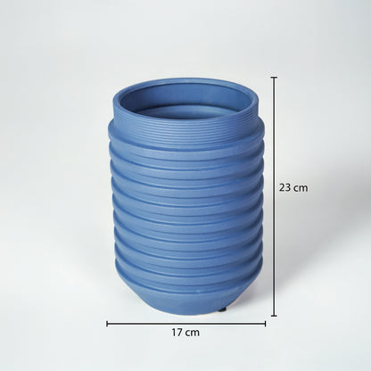 Matte blue ribbed cylindrical vase with clear dimension markings for modern minimalist home decor catalog use.