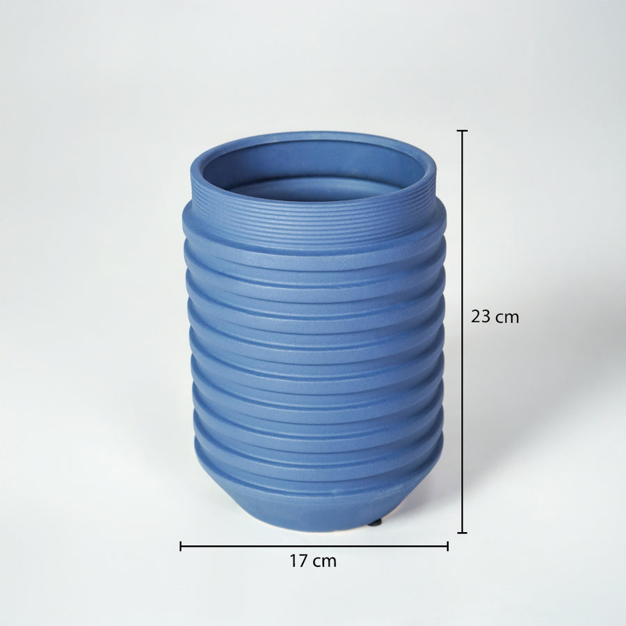 Matte blue ribbed cylindrical vase with clear dimension markings for modern minimalist home decor catalog use.