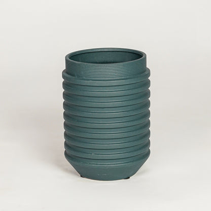 Matte dark green ribbed cylindrical vase for minimalist home decor and contemporary interior table styling needs.