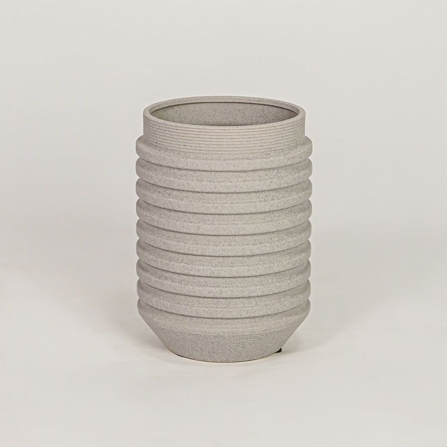Textured grey ribbed cylindrical vase for minimalist home decor and contemporary interior table styling accents.
