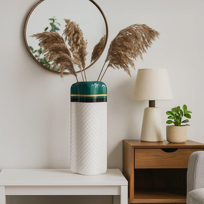 Elegant tall vase with a glossy green top and textured white body styled on a clean surface creating a refined decor look that blends easily with modern interiors.
