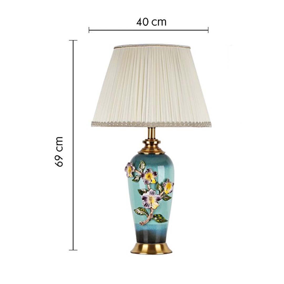 Floral ceramic table lamp with pleated shade with size 67cm height and 40cm width on white background for vintage decorative décor.