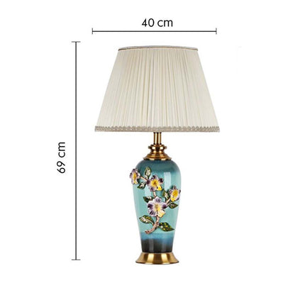 Floral ceramic table lamp with pleated shade with size 67cm height and 40cm width on white background for vintage decorative décor.