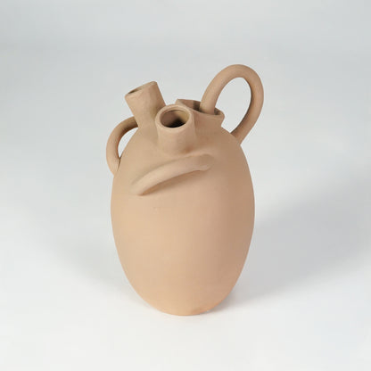 Beige ceramic vase with loop handles for stylish console table placement and contemporary indoor decor styling.