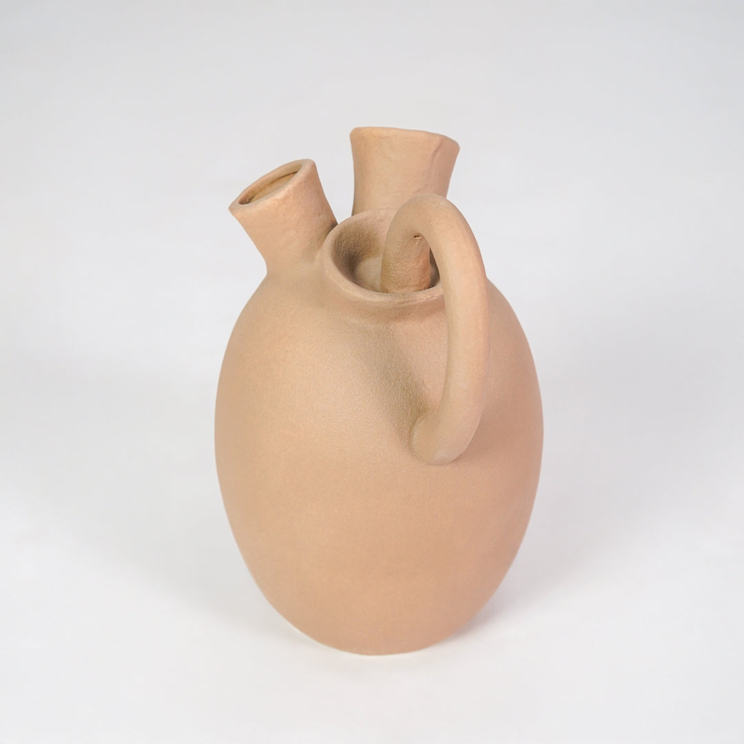 Minimalist beige ceramic vase for stylish console table placement and contemporary home decor styling piece.