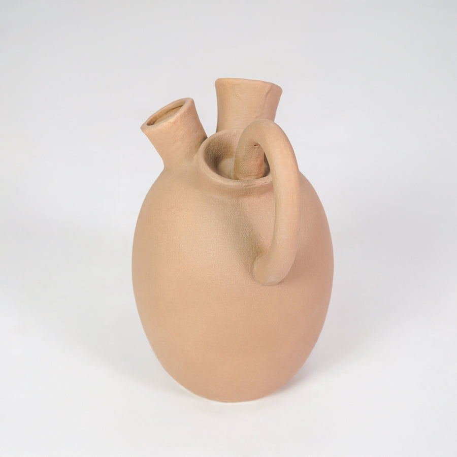 Minimalist beige ceramic vase for stylish console table placement and contemporary home decor styling piece.