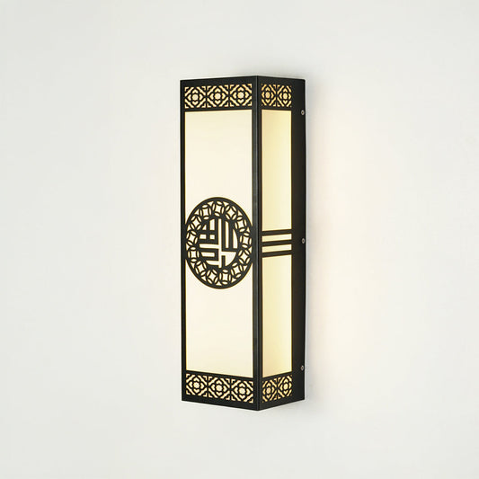 Decorative outdoor wall lantern with patterned metal frame and glass panels mounted on exterior wall ideal for porch or entry lighting.