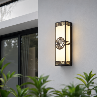 Modern black metal and glass outdoor wall light for porch entrance balcony and exterior walls with warm ambient lighting.
