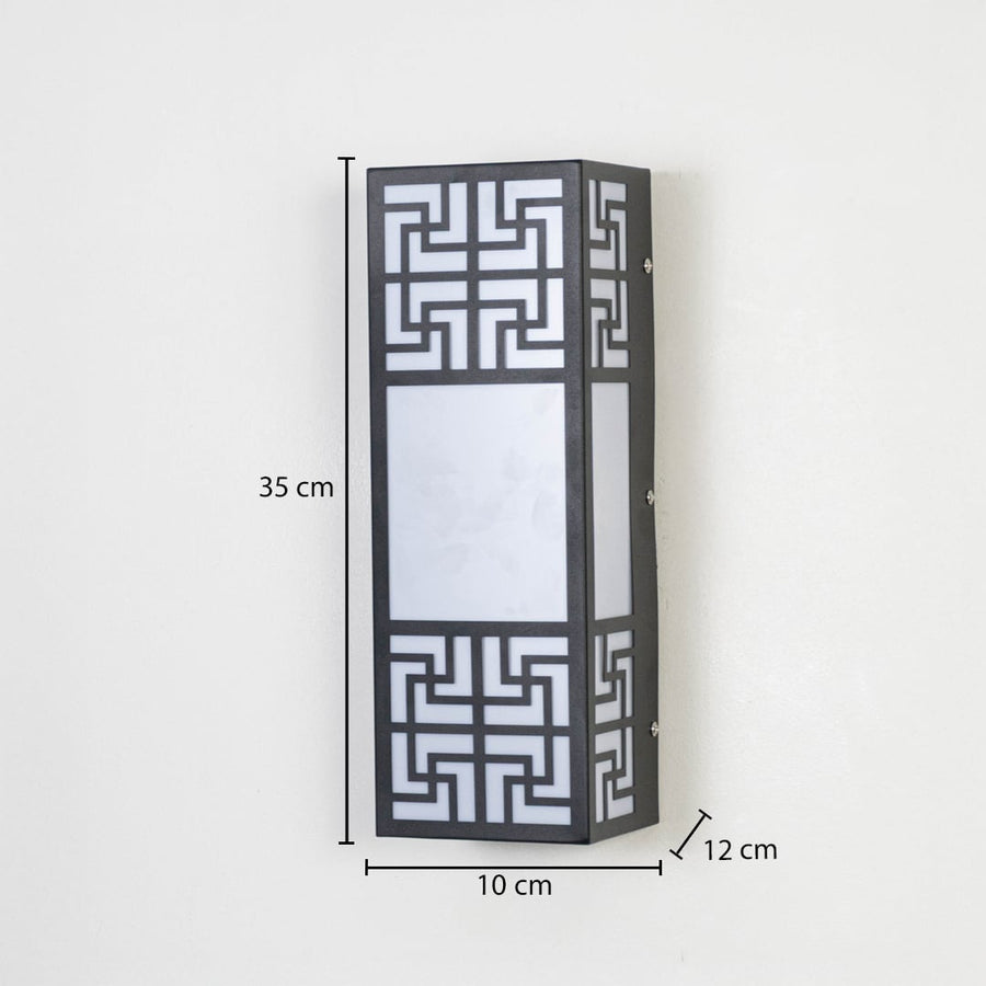 Modern outdoor wall light in black metal with frosted glass showing 35 cm height 10 cm width and 12 cm depth for exterior walls.