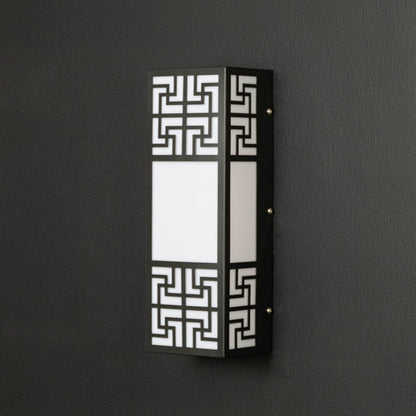 Contemporary wall light with black frame and frosted glass panel displayed off against dark background surface.