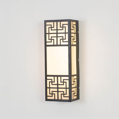 Black metal wall light on white background with geometric pattern and frosted glass for luxury decor.