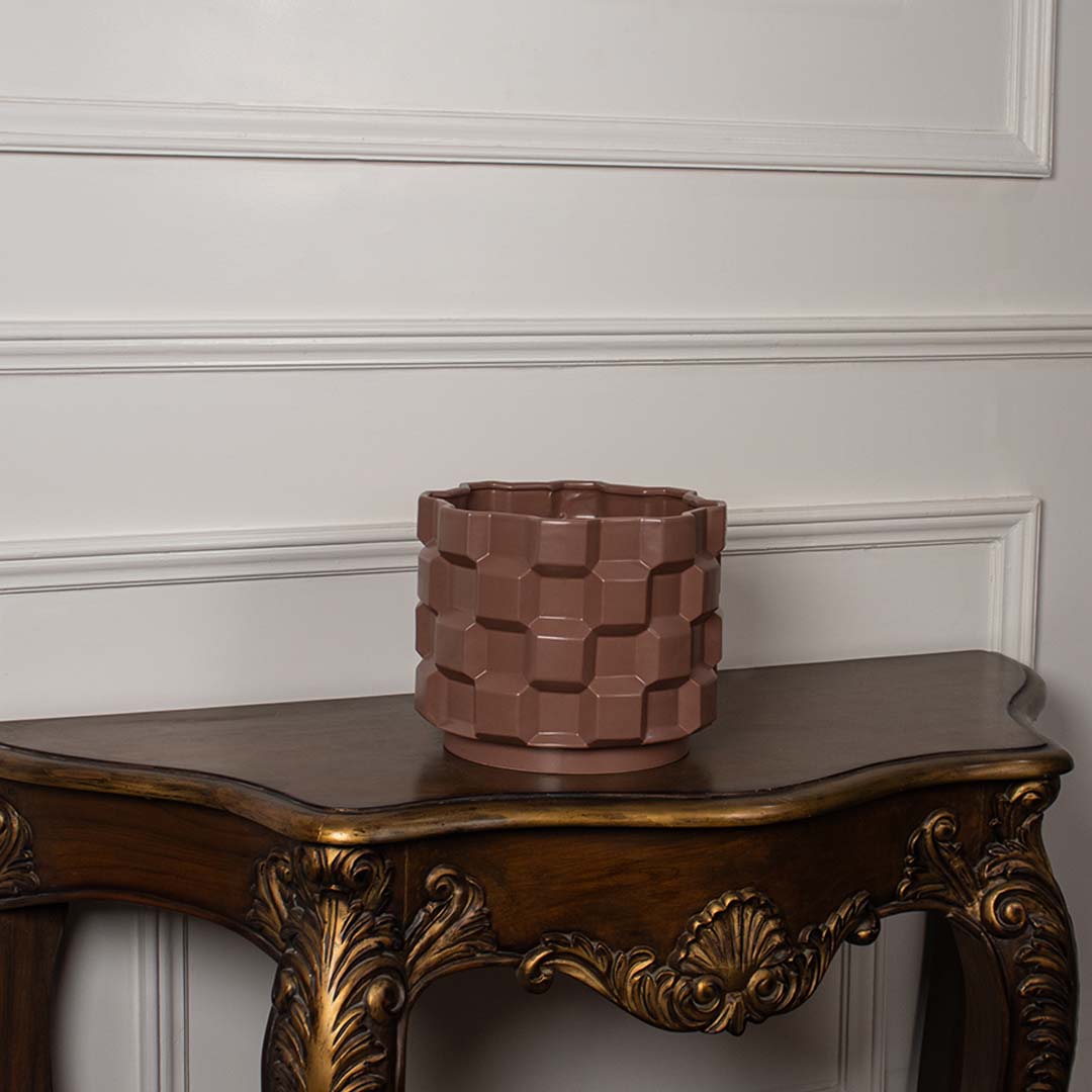Brown geometric ceramic planter displayed on a clean white background ideal for minimal home decor and stylish tabletop styling.
